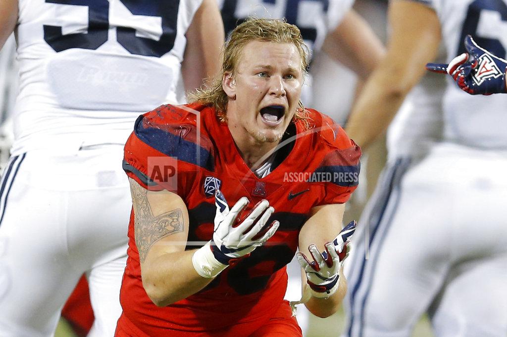 Rick Scuteri FILE - In this Sept. 1, 2018, file photo, Arizona defensive end Justin Belknap gestures in the first half during an NCAA college football game against Brigham Young, in Tucson, Ariz. Arizona was supposed to make a seamless transition to new coach Kevin Sumlin, possibly contend for a Pac-12 South title. Through two games, the Wildcats have done little but struggle under their first-year coach. (AP Photo/Rick Scuteri, File)