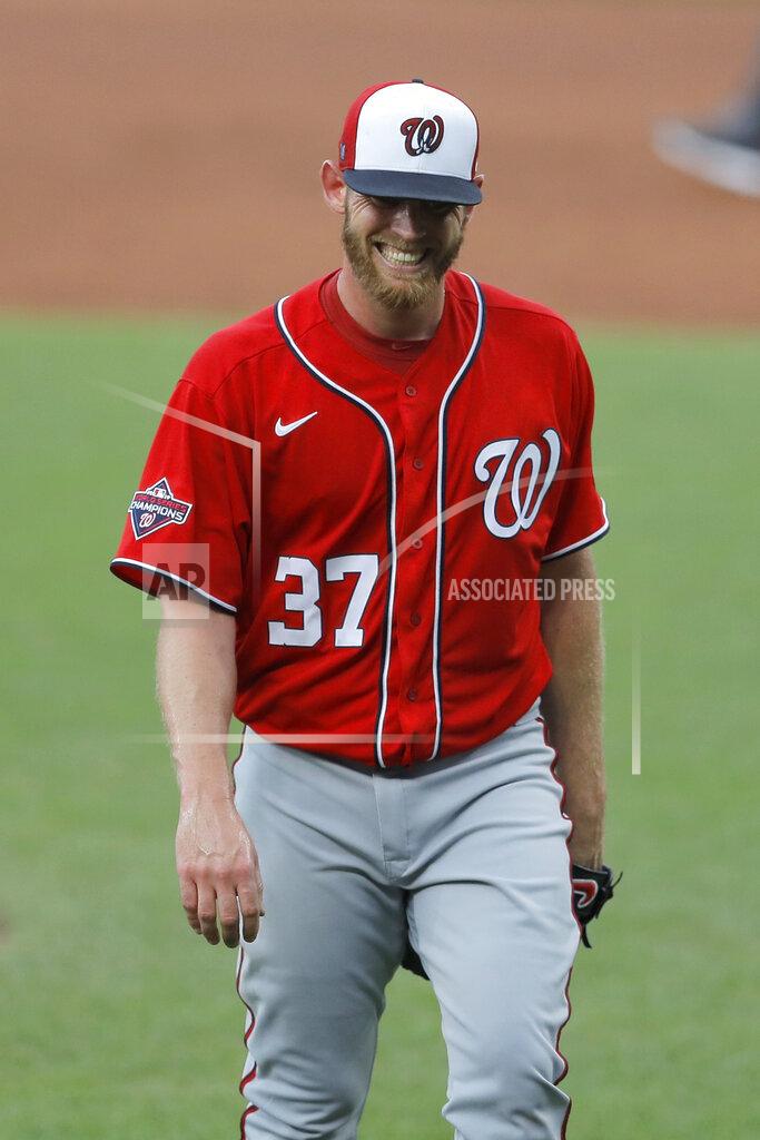 Julio Cortez Washington Nationals starting pitcher Stephen Strasburg reacts after throwing an inning against the Baltimore Orioles during an exhibition baseball game Monday, July 20, 2020, in Baltimore. (AP Photo/Julio Cortez)