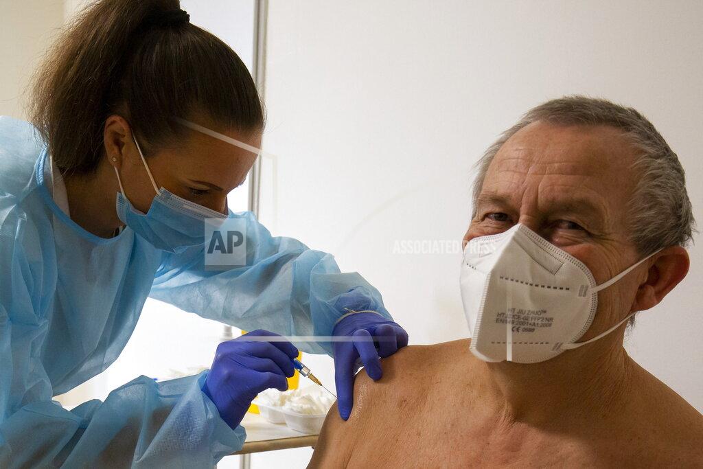 Gyorgy Varga FILE - In this file photo taken on Friday, Feb. 19, 2021, Nurse Szilvia Lukacs administers a shot of the Russian vaccine Sputnik V to a patient at Zala County Szent Rafael Hospital in Zalaegerszeg, Hungary, as the vaccination with Sputnik V against the new coronavirus continues in the country. Russia’s boast in August that it was the first country to authorize a coronavirus vaccine led to skepticism because of its insufficient testing on only a few dozen people. Now, with demand growing for the Sputnik V, experts are raising questions again, this time over whether Moscow can keep up with all the orders from countries that want it. (Gyorgy Varga/MTI via AP, File)