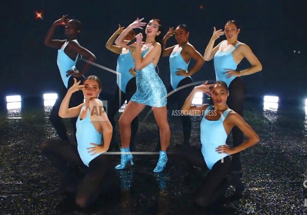 Uncredited In this screen shot provided by ABC on Sunday, Nov. 22, 2020, Dua Lipa performs “Levitating” at the American Music Awards at the Microsoft Theater in Los Angeles. (ABC via AP)