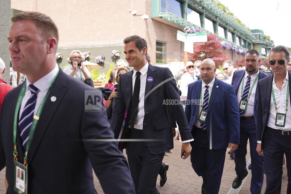Alberto Pezzali Switzerland's Roger Federer walks outside Centre Court on day seven of the Wimbledon tennis championships in London, Sunday, July 3, 2022. (AP Photo/Alberto Pezzali)