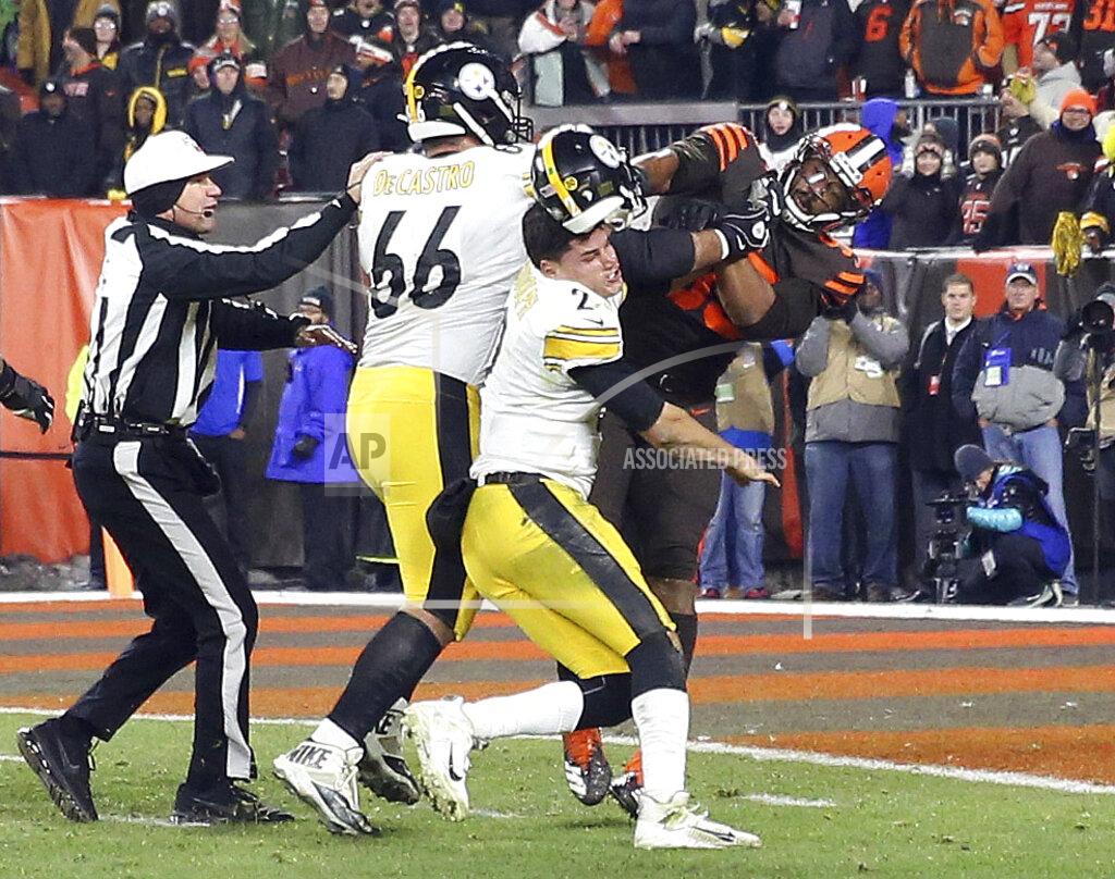 Joshua Gunter FILE - In this Nov. 14, 2019, file photo, Cleveland Browns defensive end Myles Garrett (95) hits Pittsburgh Steelers quarterback Mason Rudolph (2) with a helmet during the second half of an NFL football game in Cleveland. Suspended Browns star defensive end Myles Garrett met Monday, Feb. 10, 2020, with NFL Commissioner Roger Goodell to discuss his possible reinstatement, a person familiar with the meeting told The Associated Press. (Joshua Gunter/Cleveland.com via AP, File)
