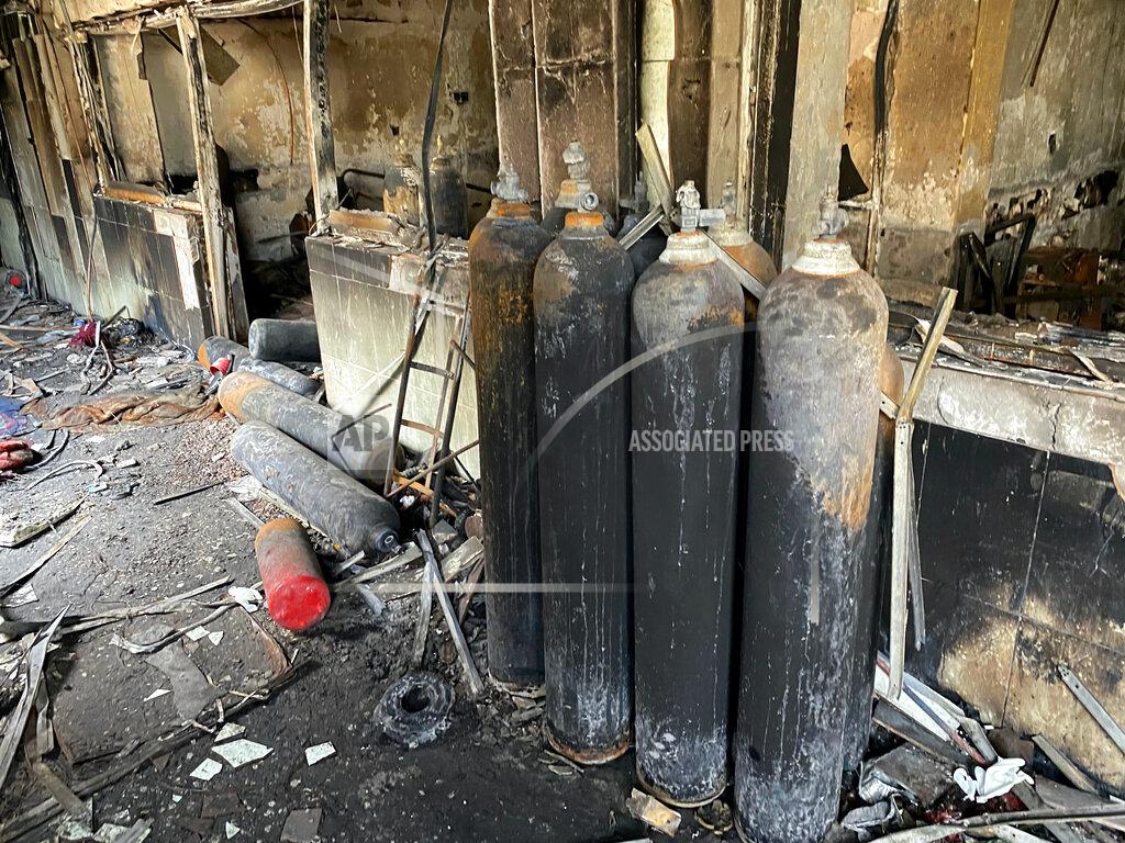 Khalid Mohammed Burned oxygen cylinders are seen in the intensive care unit of the Ibn al-Khatib hospital following a fire that broke out of last Saturday evening killing over 80 people and injuring over 100, in Baghdad, Iraq, Tuesday, April 27, 2021. Medical staff who witnessed the first moments of a Baghdad hospital fire described horrific scenes: deafening screams, a patient who jumped to his death to escape the inferno and relatives who died because they refused to abandon coronavirus patients tethered to ventilators. (AP Photo/Khalid Mohammed)