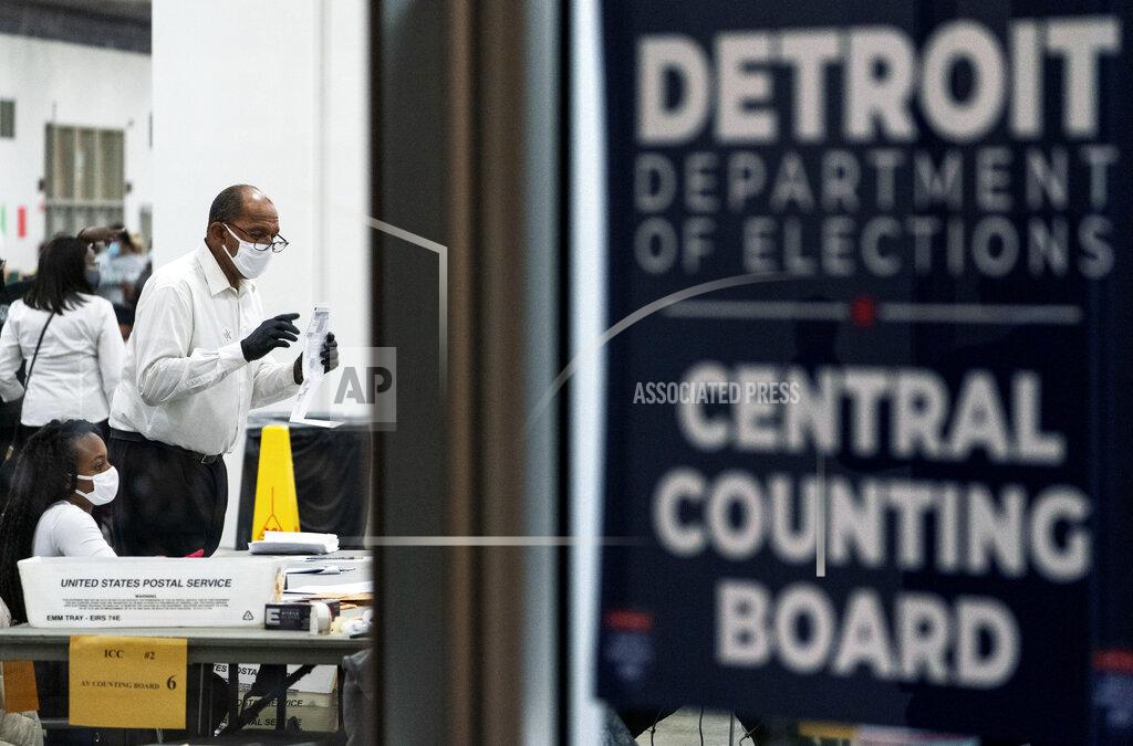 David Goldman Election inspectors count ballots into the early morning hours of Wednesday, Nov. 4, 2020, at the central counting board in Detroit. (AP Photo/David Goldman)