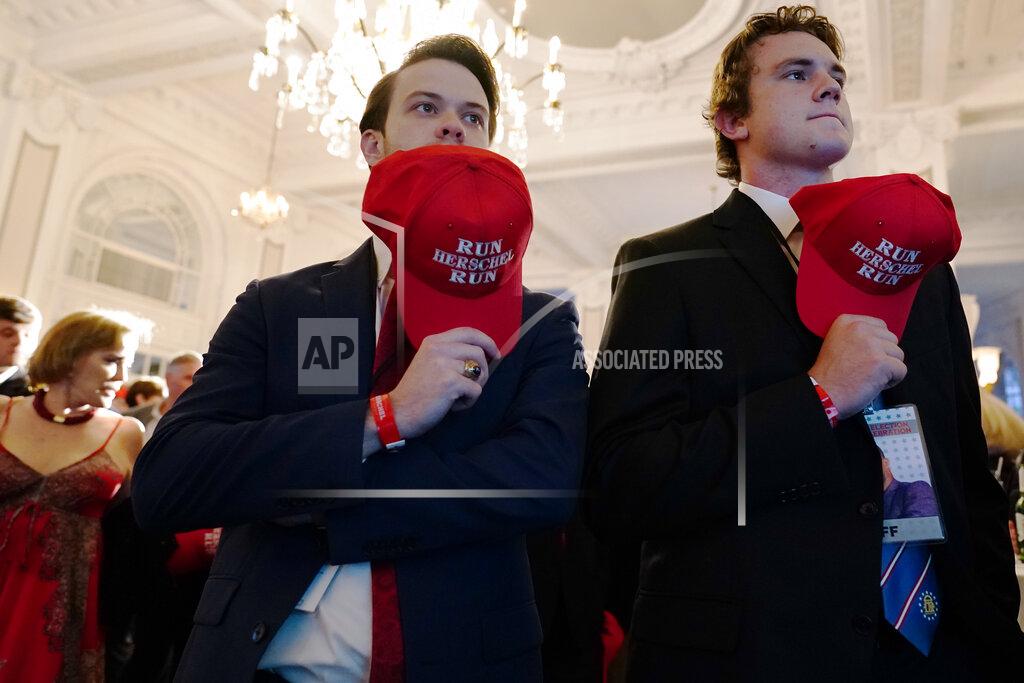 Brynn Anderson Supporters wait to hear U.S. Senate candidate Herschel Walker during an election night watch party, Tuesday, May 24, 2022, in Atlanta. Walker won the Republican nomination for U.S. Senate in Georgia's primary election. (AP Photo/Brynn Anderson)