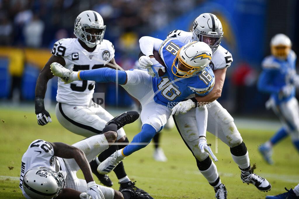 Kelvin Kuo Los Angeles Chargers wide receiver Andre Patton is tackled by Oakland Raiders inside linebacker Will Compton during the first half of an NFL football game Sunday, Dec. 22, 2019, in Carson, Calif. (AP Photo/Kelvin Kuo)