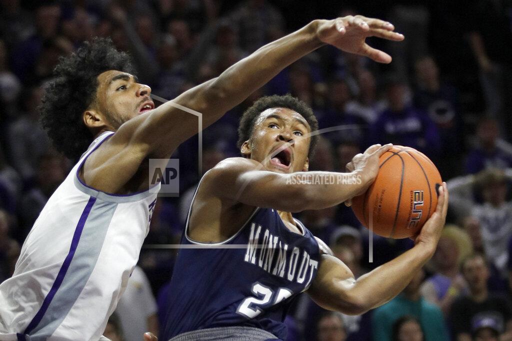 Orlin Wagner Monmouth forward Nikkei Rutty (21) shoots as Kansas State forward Antonio Gordon, left, defends during the first half of an NCAA college basketball game in Manhattan, Kan., Wednesday, Nov. 13, 2019. (AP Photo/Orlin Wagner)