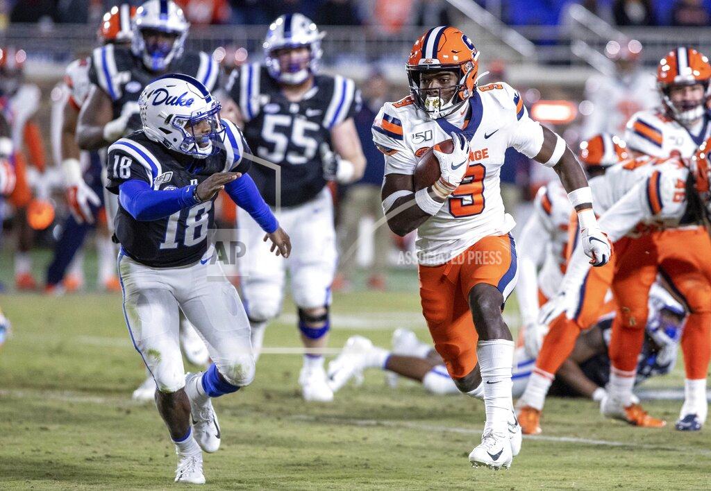 Ben Mckeown Syracuse's Evan Foster (9) carries the ball past Duke's Quentin Harris (18) after recovering a fumble during the second half of an NCAA college football game in Durham, N.C., Saturday, Nov. 16, 2019. (AP Photo/Ben McKeown)