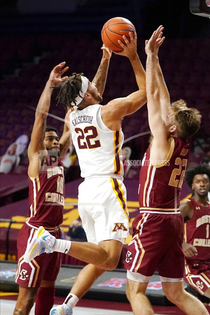 Jim Mone Minnesota's Gabe Kalscheur (22) shoots as Boston College's Rich Kelly (22) defends during the first half of an NCAA college basketball game Tuesday, Dec. 8, 2020, in Minneapolis. (AP Photo/Jim Mone)