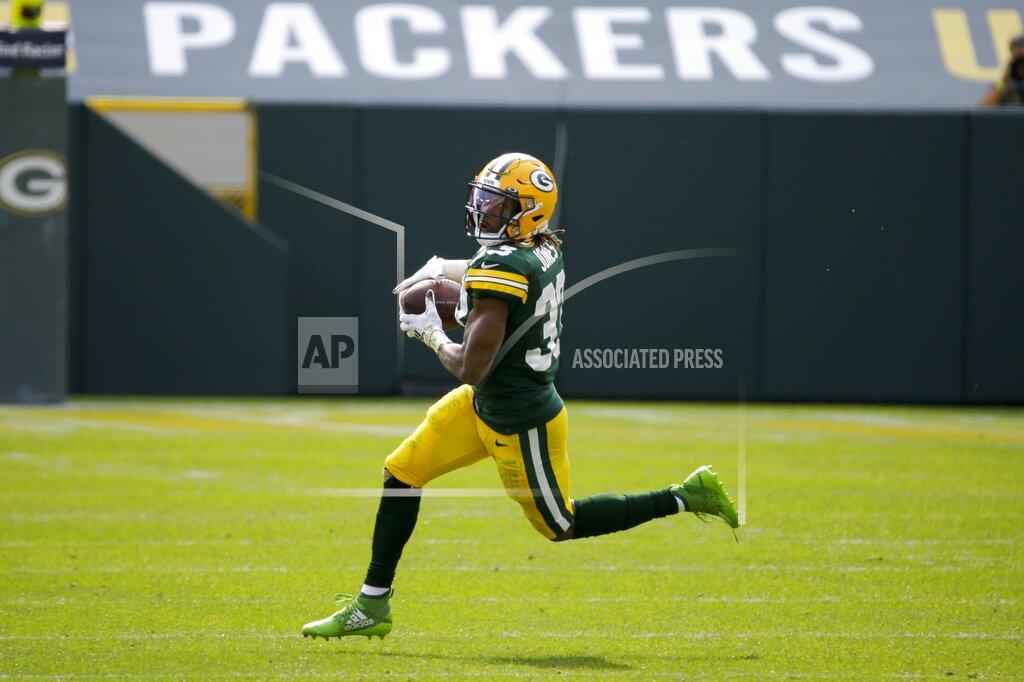 Mike Roemer Green Bay Packers' Aaron Jones catches a pass during the first half of an NFL football game against the Detroit Lions Sunday, Sept. 20, 2020, in Green Bay, Wis. (AP Photo/Mike Roemer)