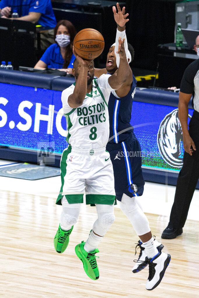 Sam Hodde Boston Celtics guard Kemba Walker (8) shoots as Dallas Mavericks guard Josh Richardson defends during the first half of an NBA basketball game in Dallas, Tuesday, Feb. 23, 2021. (AP Photo/Sam Hodde)