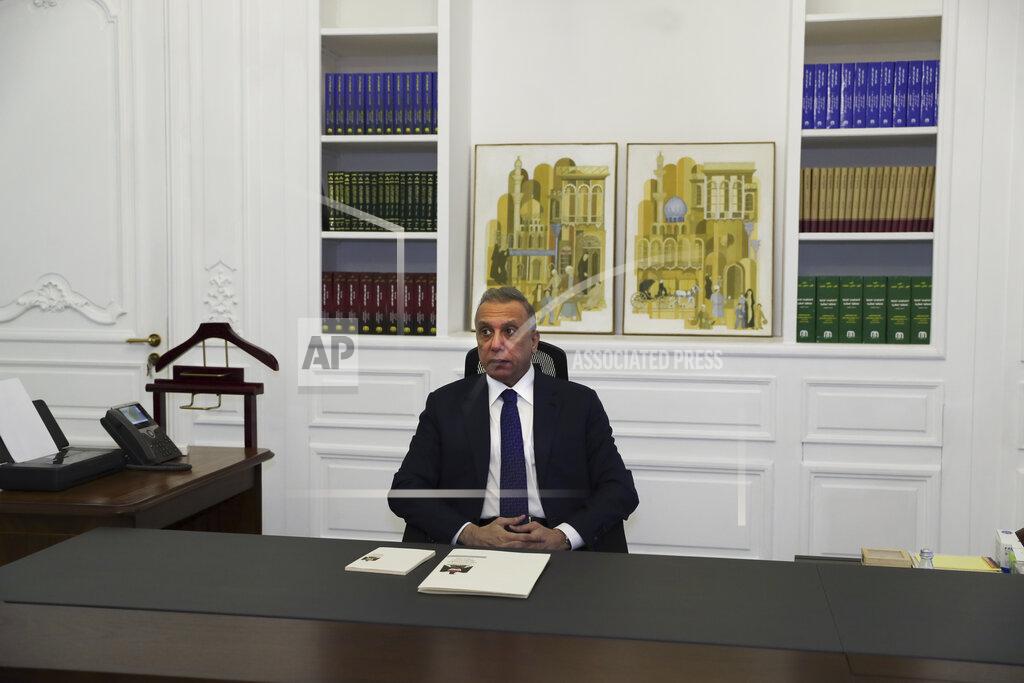 Khalid Mohammed Iraqi Prime Minister Mustafa al-Kadhimi poses in his office during an interview with The Associated Press in Baghdad, Iraq, Friday, July 23, 2021. (AP Photo/Khalid Mohammed)