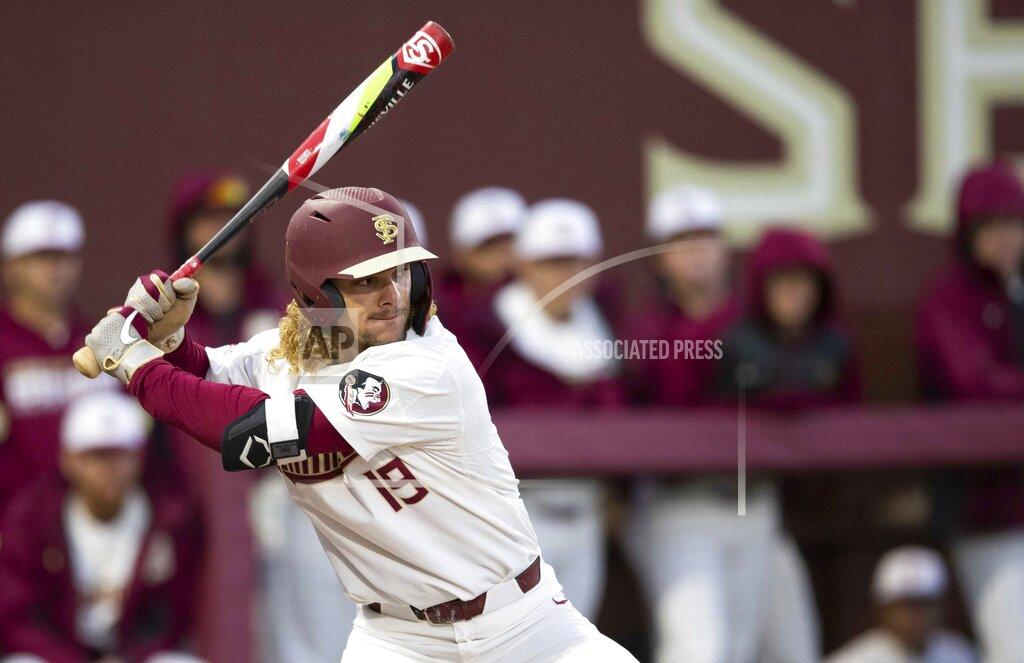 Alicia Devine Florida State NCAA college baseball outfielder Elijah Cabell (19) bats against the Univ. of Cincinnati, Friday, Feb. 21, 2020, in Tallahassee, Fla. If all had gone as he hoped, Cabell and his Florida State teammates would be playing for the College World Series championship this week. Instead, Cabell treks to a ball field in his neighborhood in Winter Park, Florida, most days to work on his game in solitude. (Alicia Devine/Tallahassee Democrat via AP)