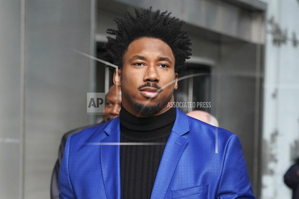 FILE - In this Nov. 20, 2019, file photo, Cleveland Browns star defensive end Myles Garrett leaves an office building in New York. Suspended Browns star defensive end Myles Garrett met Monday, Feb. 10, 2020, with NFL Commissioner Roger Goodell to discuss his possible reinstatement, a person familiar with the meeting told The Associated Press. (AP Photo/Seth Wenig, File)