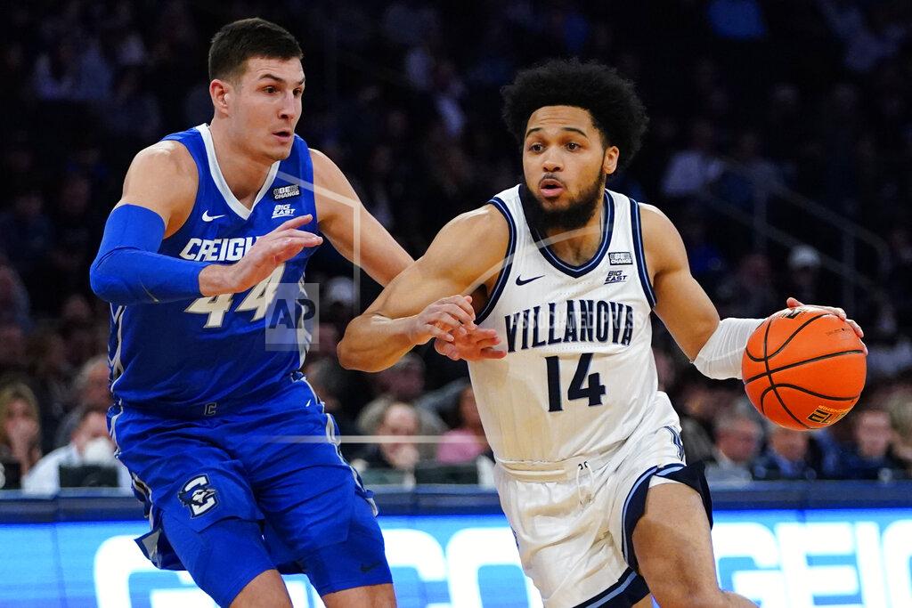 Frank Franklin Ii Villanova's Caleb Daniels (14) drives past Creighton's Ryan Hawkins (44) during the first half of an NCAA college basketball game in the final of the Big East conference tournament Saturday, March 12, 2022, in New York. (AP Photo/Frank Franklin II)