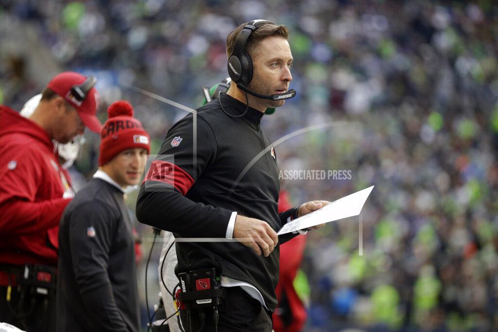 Arizona Cardinals head coach Kliff Kingsbury wears a headset on the sideline during the first half of an NFL football game against the Seattle Seahawks, Sunday, Dec. 22, 2019, in Seattle. (AP Photo/Lindsey Wasson)