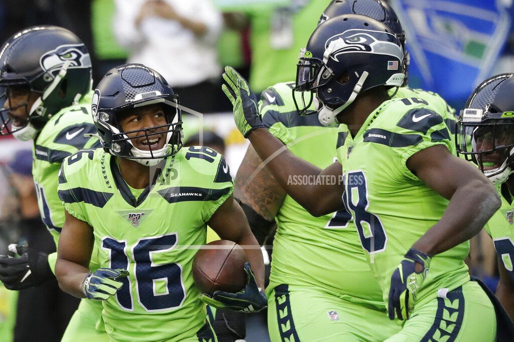 Elaine Thompson Seattle Seahawks wide receiver Tyler Lockett (16) is greeted by wide receiver Jaron Brown, right, after Lockett scored a touchdown against the Los Angeles Rams during the first half of an NFL football game Thursday, Oct. 3, 2019, in Seattle. (AP Photo/Elaine Thompson)