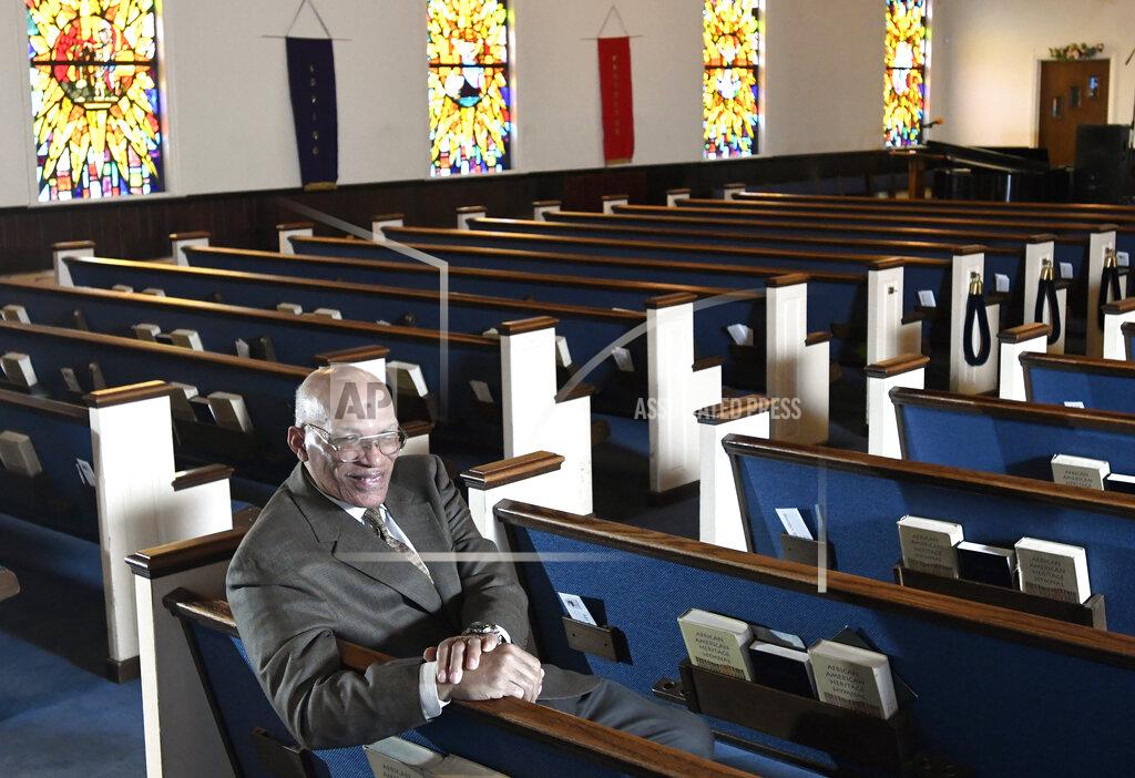 Steve Ruark FILE - In this Thursday, March 19, 2020 file photo, the Rev. Alvin J. Gwynn Sr., of Friendship Baptist Church in Baltimore, sits for a portrait in his church. At the mostly African American congregation, Gwynn has held in-person services throughout the pandemic, but attendance hasn't risen much above 80 people — a small fraction of normal. (AP Photo/Steve Ruark)