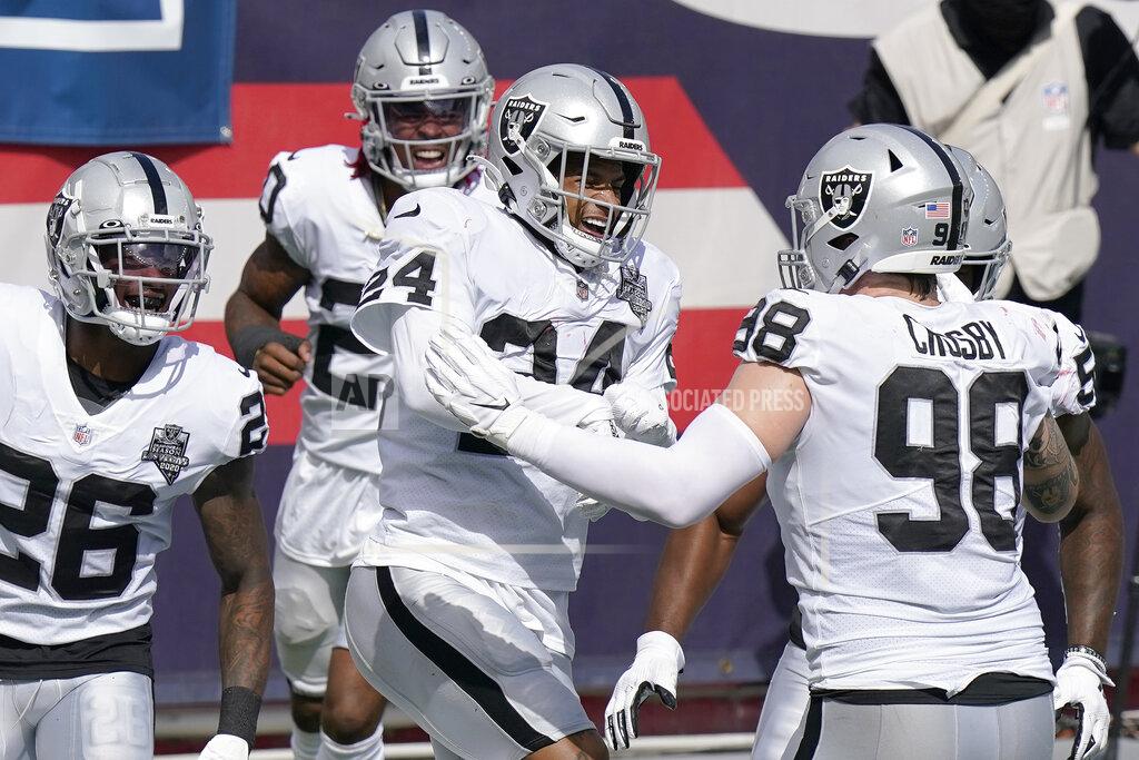 Steven Senne Las Vegas Raiders safety Johnathan Abram (24) celebrates his interception with teammates in the first half of an NFL football game against the New England Patriots, Sunday, Sept. 27, 2020, in Foxborough, Mass. (AP Photo/Steven Senne)