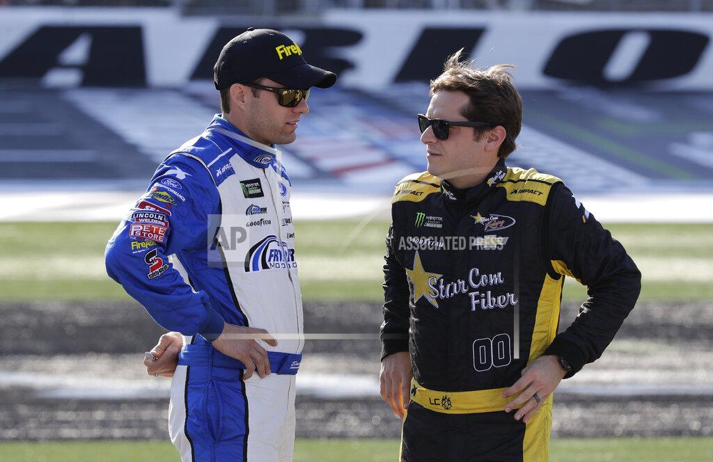 Chuck Burton David Ragan, left, talks with Landon Cassill before qualifying for Saturday's NASCAR All-Star Cup series auto race at Charlotte Motor Speedway in Concord, N.C., Friday, May 17, 2019. (AP Photo/Chuck Burton)