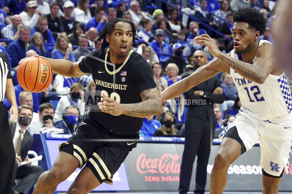 James Crisp Vanderbilt's Jamaine Mann, left, drives while defended by Kentucky's Keion Brooks Jr. (12) during the second half of an NCAA college basketball game in Lexington, Ky., Wednesday, Feb. 2, 2022. Kentucky won 77-70. (AP Photo/James Crisp)