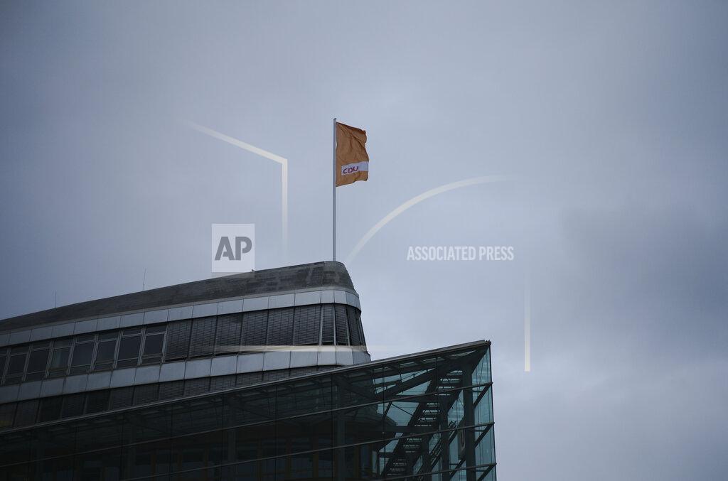 Markus Schreiber A flag of Germany's Christian Democratic Union party, CDU, the party of Chancellor Angela Merkel, waves in the wind on top of the party's headquarters in Berlin, Germany, Sunday, March 14, 2021. Regional election in federal German states Baden Wuerttemberg and Rhineland-Palatinate are held today. (AP Photo/Markus Schreiber, Pool)