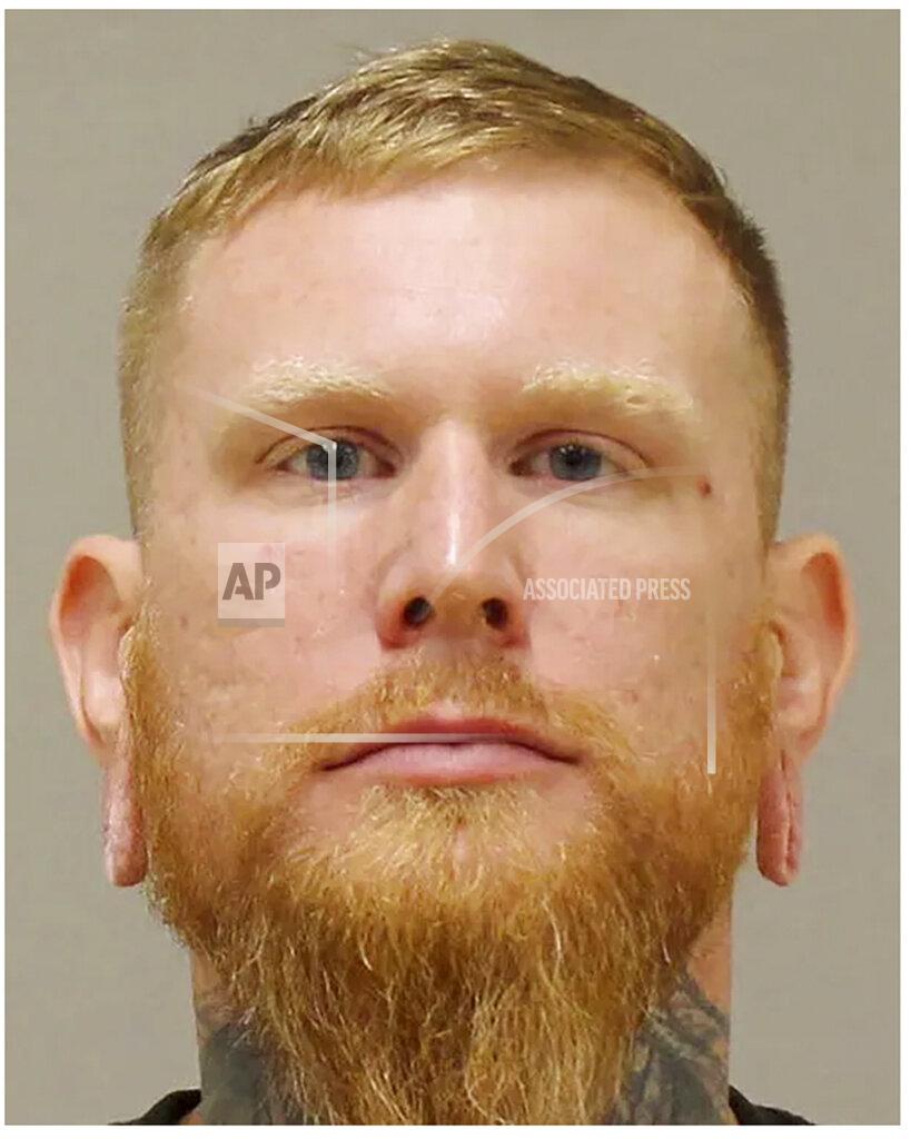 Uncredited In a photo provided by the Kent County Sheriff, Brandon Caserta is shown in a booking photo. Caserta is one of several people charged with plotting to kidnap Michigan Democratic Gov. Gretchen Whitmer, authorities said Thursday, Oct. 8, 2020, in announcing charges in an alleged scheme that involved months of planning and even rehearsals to snatch Whitmer from her vacation home. (Kent County Sheriff via AP)