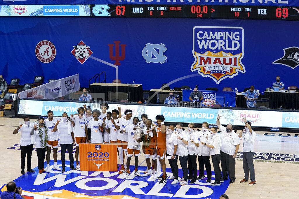 Kathy Kmonicek Texas celebrates its 69-67 win over North Carolina in an NCAA college basketball game for the championship of the Maui Invitational, Wednesday, Dec. 2, 2020, in Asheville, N.C. (AP Photo/Kathy Kmonicek)