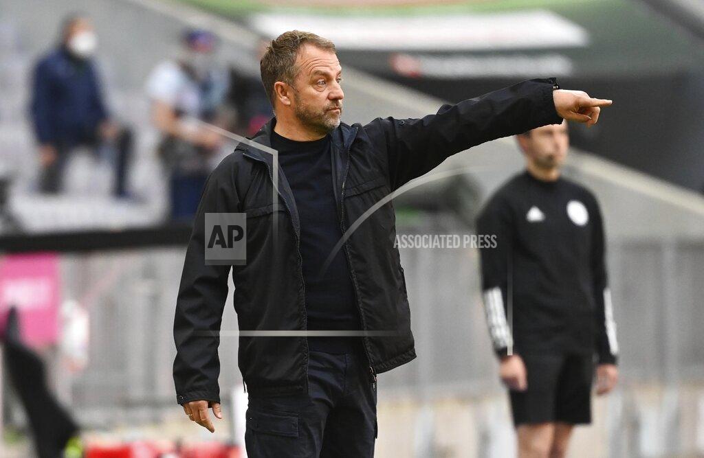 Sven Hoppe Bayern's head coach Hans-Dieter Flick gives instructions during the German Bundesliga soccer match between Bayern Munich and FC Union Berlin at Allianz Arena in Munich, Germany, Saturday, April 10, 2021.(Sven Hoppe/Pool via AP)