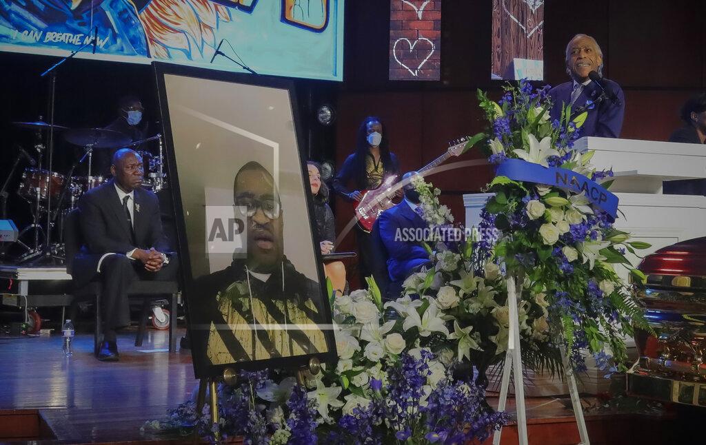 Bebeto Matthews FILE - In this June 4, 2020, file photo, civil rights attorney Ben Crump listens as Rev. Al Sharpton delivers the eulogy at the funeral George Floyd in Minneapolis. For more than three decades, Sharpton, 65, has been a go-to advocate for Black American families seeking justice and peace in the wake of violence and countless incidents that highlight systemic racism.
(AP Photo/Bebeto Matthews, File)