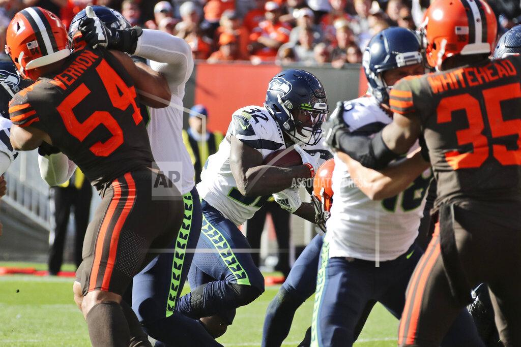 Ron Schwane Seattle Seahawks running back Chris Carson (32) rushes for a 1-yard touchdown during the second half of an NFL football game against the Cleveland Browns, Sunday, Oct. 13, 2019, in Cleveland. (AP Photo/Ron Schwane)