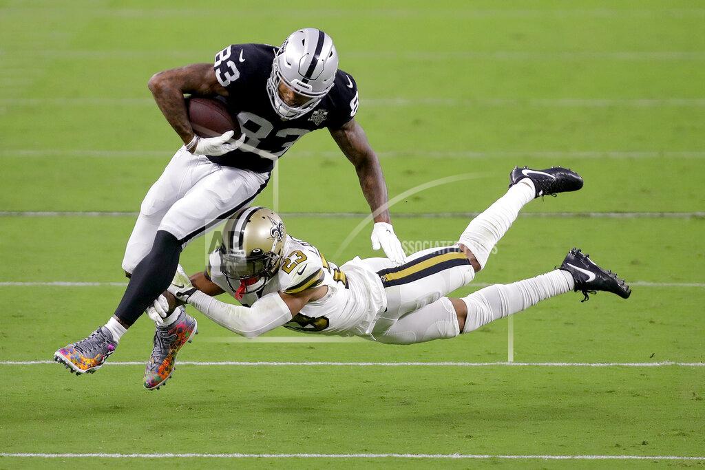 Isaac Brekken New Orleans Saints cornerback Marshon Lattimore (23) tackles Las Vegas Raiders tight end Darren Waller (83) during the first half of an NFL football game, Monday, Sept. 21, 2020, in Las Vegas. (AP Photo/Isaac Brekken)
