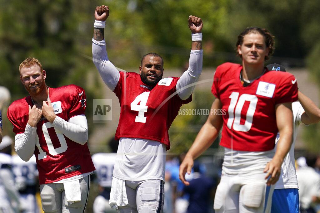 Ashley Landis Dallas Cowboys quarterback Cooper Rush, left, quarterback Dak Prescott (4), and Los Angeles Chargers quarterback Justin Herbert, right, participate in drills during a combined NFL practice at the Los Angeles Rams' practice facility in Costa Mesa, Calif. Thursday, Aug. 18, 2022. (AP Photo/Ashley Landis)