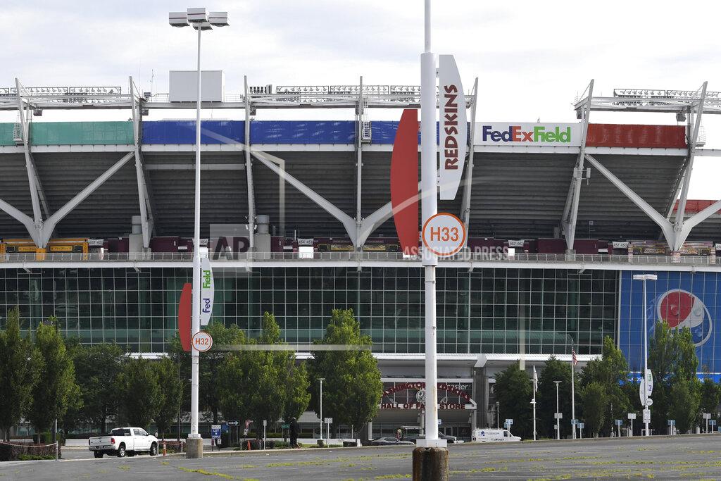 Susan Walsh Signs for the Washington Redskins are displayed outside FedEx Field in Landover, Md., Monday, July 13, 2020. The Washington NFL franchise announced Monday that it will drop the "Redskins" name and Indian head logo immediately, bowing to decades of criticism that they are offensive to Native Americans. (AP Photo/Susan Walsh)