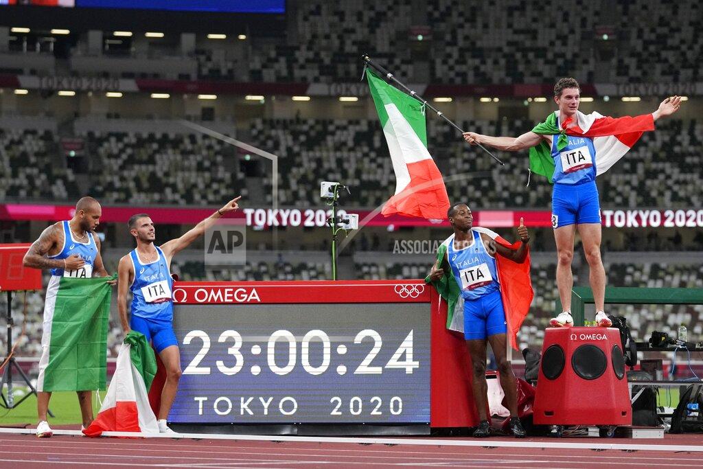 Petr David Josek Team Italy celebrates after winning the men's 4x100-meter relay final at the 2020 Summer Olympics, Friday, Aug. 6, 2021, in Tokyo. (AP Photo/Petr David Josek)