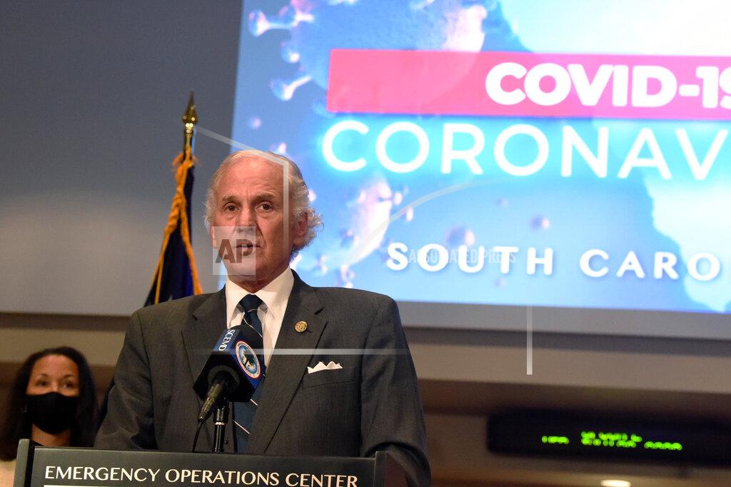 South Carolina Gov. Henry McMaster, right, speaks during a COVID-19 briefing as state epidemiologist Linda Bell, left, looks on, on Wednesday, July 29, 2020, in West Columbia, S.C. As of Monday, McMaster says all businesses will be allowed to be open, as long as they adhere to social distancing and capacity limits. (AP Photo/Meg Kinnard)