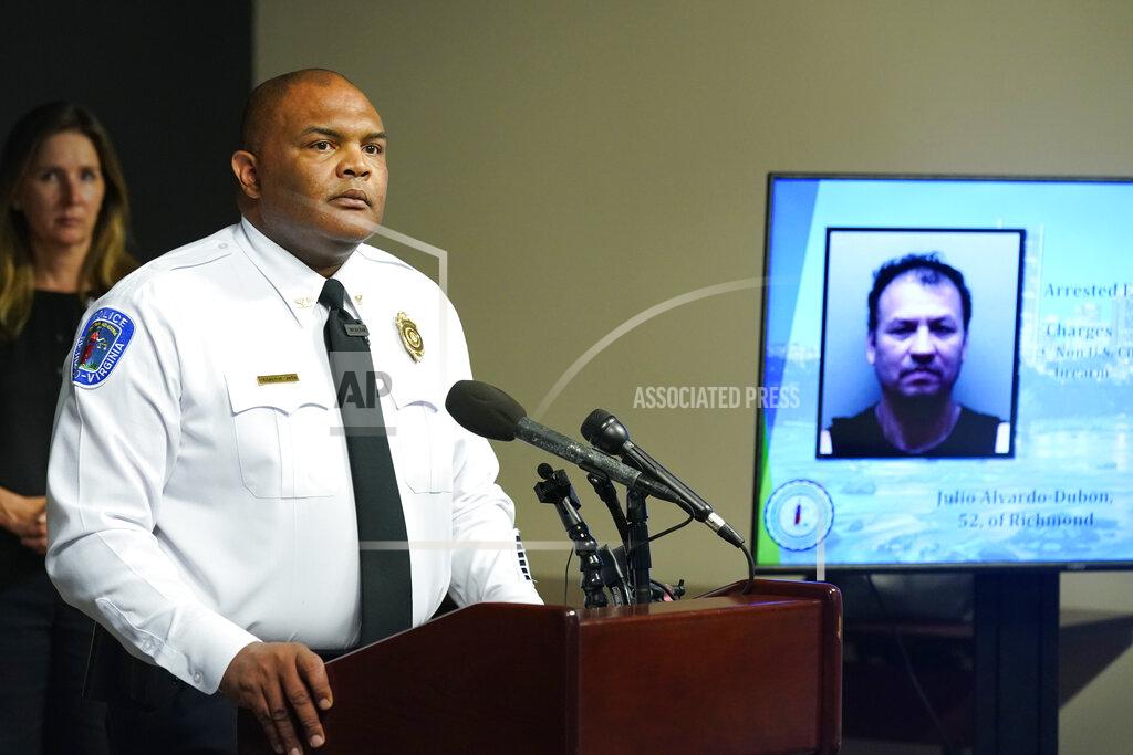 Steve Helber Richmond Police Chief Gerald M Smith listens to a question in front of a photo of one of two suspects during a press conference at Richmond Virginia Police headquarters Wednesday July 6, 2022, in Richmond, Va. Police said Wednesday that they thwarted a planned July 4 mass shooting after receiving a tip that led to arrests and the seizure of multiple guns — an announcement that came just two days after a deadly mass shooting on the holiday in a Chicago suburb. (AP Photo/Steve Helber)
