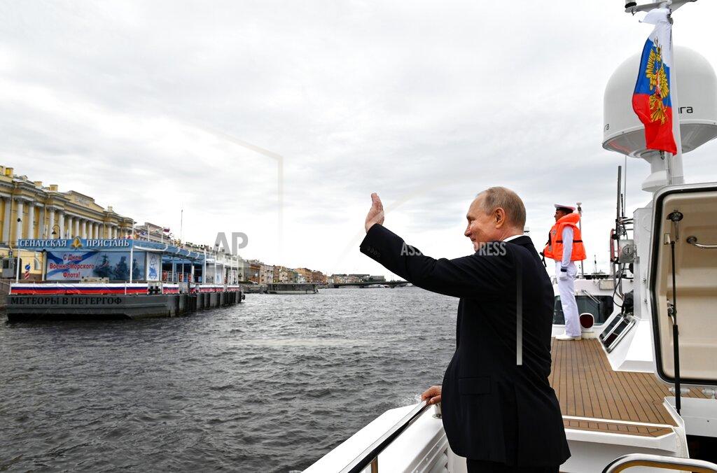 Alexei Nikolsky Russian President Vladimir Putin waves to spectators as he leaves the Navy Day parade in St. Petersburg, Russia, Sunday, July 25, 2021. (Alexei Nikolsky, Sputnik, Kremlin Pool Photo via AP)