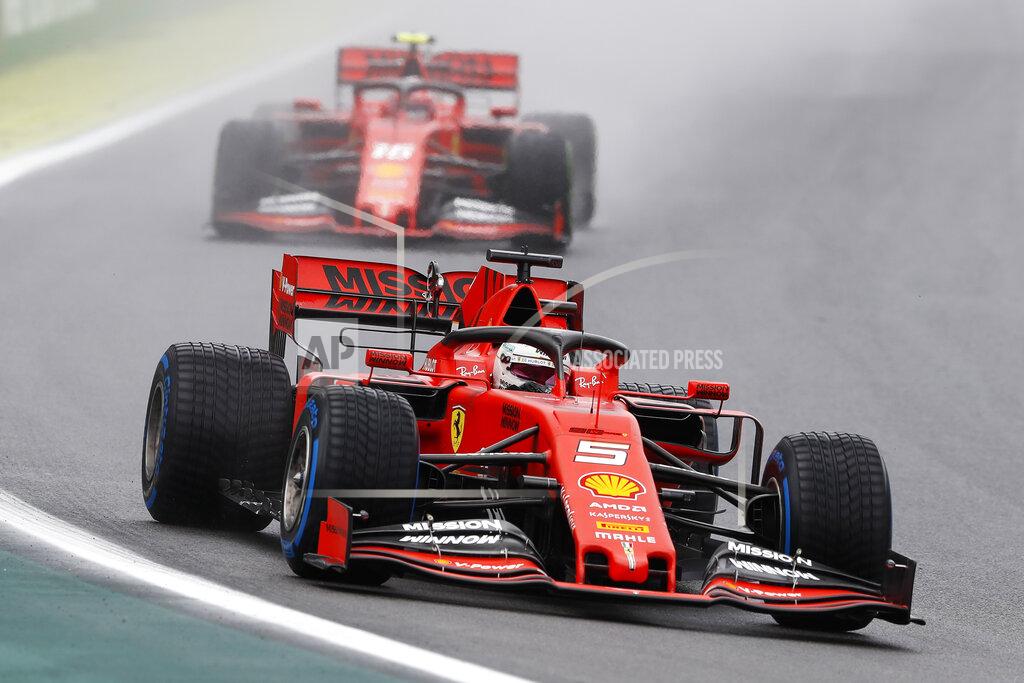 Ferrari driver Sebastian Vettel, of Germany, steers his car followed by his teammate Charles Leclerc, of Monaco, during the first free practice at the Interlagos race track in Sao Paulo, Brazil, Friday, Nov. 15, 2019. (AP Photo/Nelson Antoine)