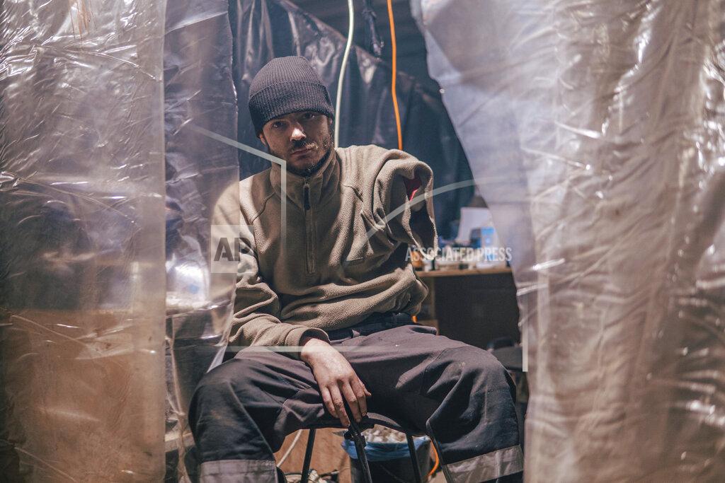 Dmytro 'ORest' Kozatskyi In this photo provided by Azov Special Forces Regiment of the Ukrainian National Guard Press Office, an Azov Special Forces Regiment's serviceman, injured during fighting against Russian forces, poses for a photographer inside the Azovstal steel plant in Mariupol, Ukraine, Tuesday, May 10, 2022. (Dmytro 'Orest' Kozatskyi/Azov Special Forces Regiment of the Ukrainian National Guard Press Office via AP)