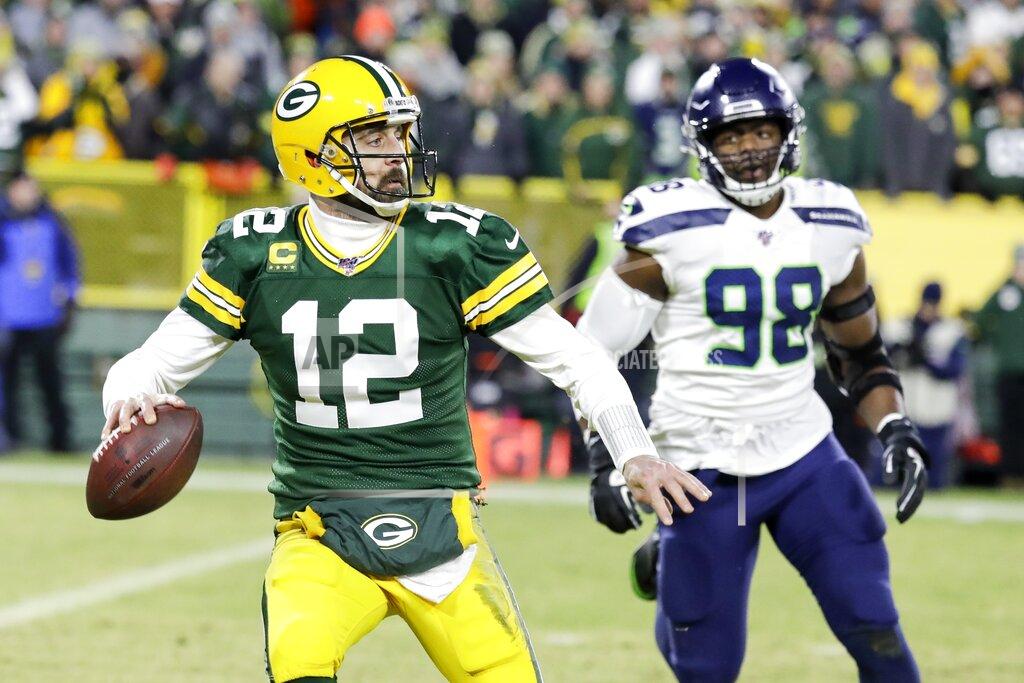 Darron Cummings Green Bay Packers' Aaron Rodgers scrambles during the first half of an NFL divisional playoff football game against the Seattle Seahawks Sunday, Jan. 12, 2020, in Green Bay, Wis. (AP Photo/Darron Cummings)