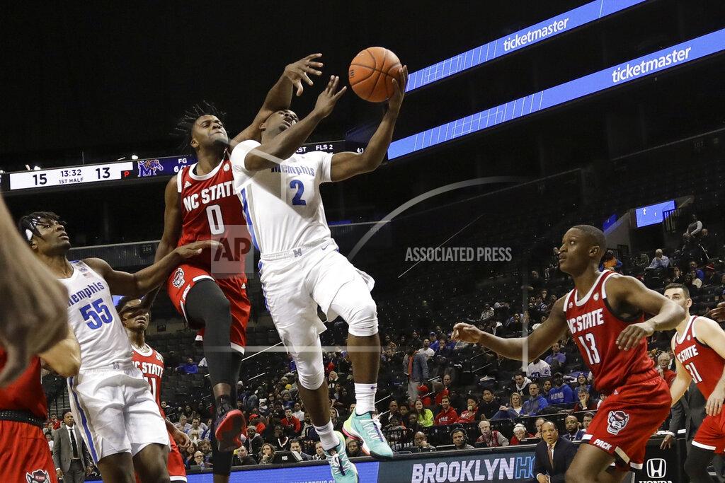 Frank Franklin Ii Memphis' Alex Lomax (2) drives past North Carolina State's DJ Funderburk (0) and C.J. Bryce (13) during the first half of an NCAA college basketball game in the Barclays Classic, Thursday, Nov. 28, 2019, in New York. (AP Photo/Frank Franklin II)