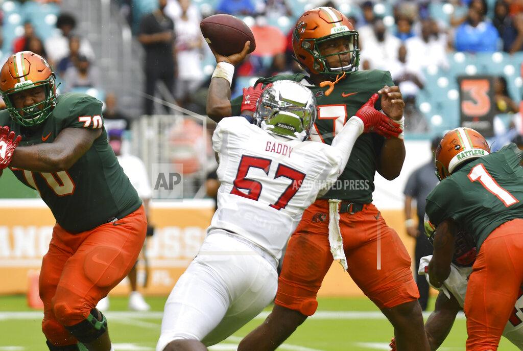 Jim Rassol Florida A&M quarterback Junior Muratovic (7) is pressured by Jackson State linebacker Nyles Gaddy (57) in the first quarter of an NCAA college football game, Sunday, Sept. 5, 2021, in Miami Gardens, Fla. (AP Photo/Jim Rassol)