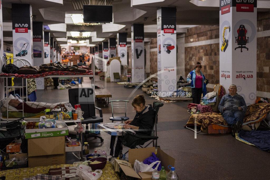 Bernat Armangue A woman cuts vegetables in the city subway of Kharkiv, in eastern Ukraine, on Thursday, May 19, 2022. Although the bombings in Kharkiv have decreased and the subway is expected to run beginning of next week, still some residents use it as a temporary bomb shelter. (AP Photo/Bernat Armangue)