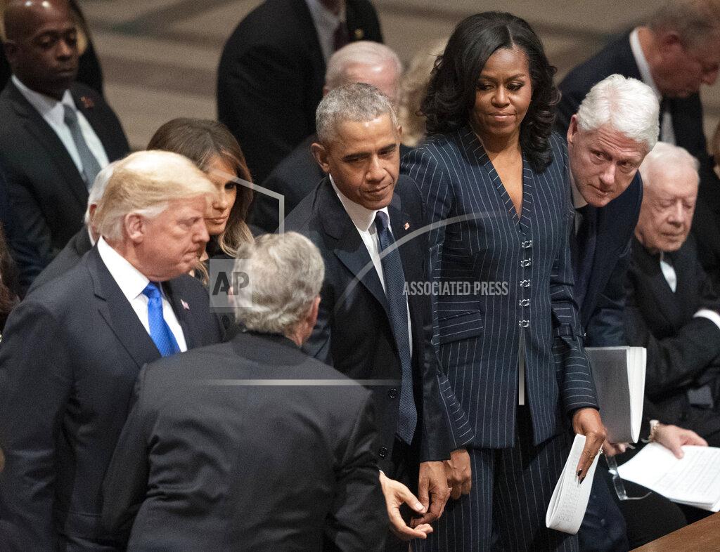 Carolyn Kaster FILE - In this Dec. 5, 2018 file photo former President George W. Bush greets President Donald Trump, first lady Melania Trump, former President Barack Obama, Michelle Obama, former President Bill Clinton, former Secretary of State Hillary Clinton, and former President Jimmy Carter during a State Funeral for former President George H.W. Bush at the National Cathedral in Washington.(AP Photo/Carolyn Kaster, File)