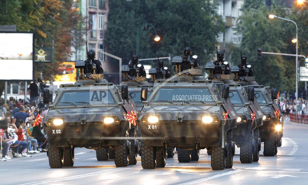 Boris Grdanoski Police armored vehicles participate in a parade to mark the Independence Day in downtown Skopje, North Macedonia, Wednesday, Sept. 8, 2021. North Macedonia is celebrating Wednesday the 30th anniversary since its independence from former Yugoslavia. (AP Photo/Boris Grdanoski)