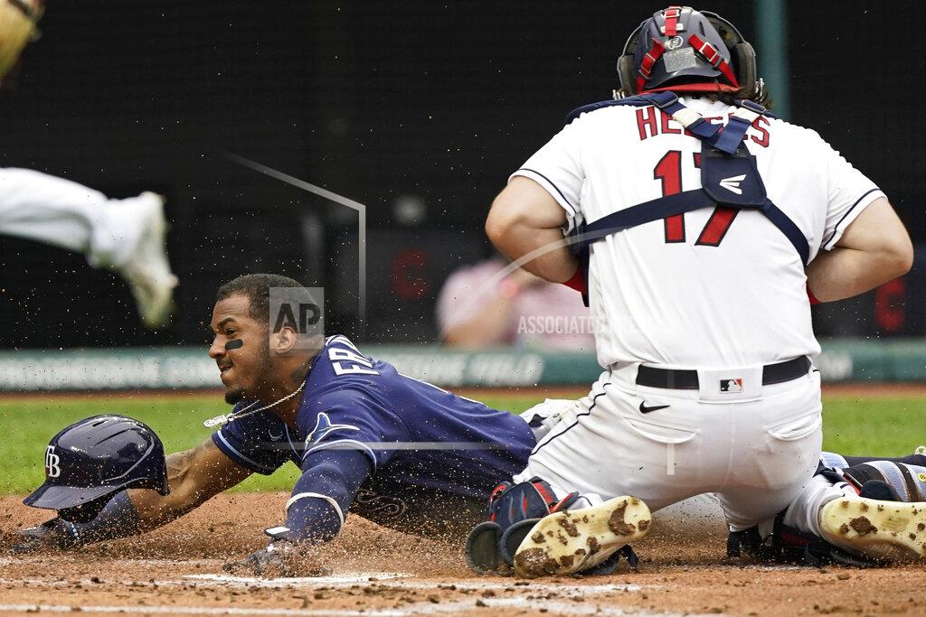 Tony Dejak Tampa Bay Rays' Wander Franco scores as Cleveland Indians catcher Austin Hedges gathers in the throw during the second inning of a baseball game Friday, July 23, 2021, in Cleveland. (AP Photo/Tony Dejak)