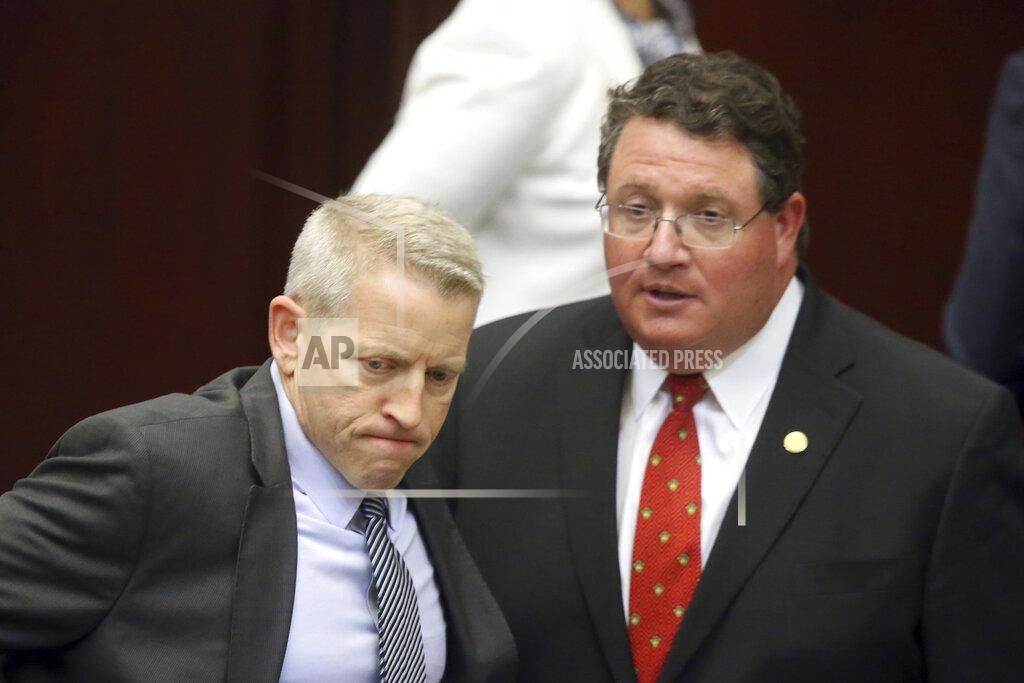 Rep. Randy Fine, R-South Brevard County, right, and Rep. Paul Renner, R-Palm Coast prepare for the start of a special session, Monday, May 17, 2021, in Tallahassee, Fla. (AP Photo/Steve Cannon)