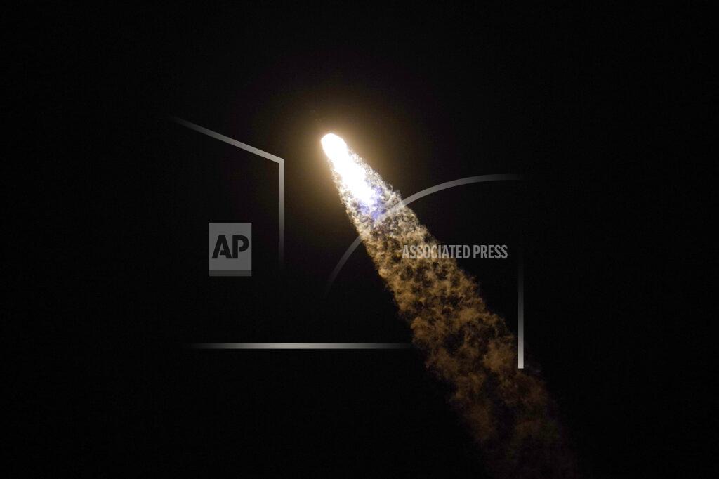 John Raoux A SpaceX Falcon 9 rocket with the Crew Dragon space capsule leaves a trail of smoke as it lifts off from pad 39A at the Kennedy Space Center in Cape Canaveral, Fla., Friday, April 23, 2021. (AP Photo/John Raoux)