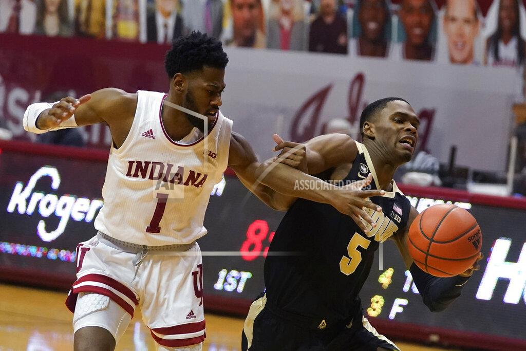 Darron Cummings Purdue's Brandon Newman (5) is fouled by Indiana's Al Durham (1) during the first half of an NCAA college basketball game, Thursday, Jan. 14, 2021, in Bloomington Ind. (AP Photo/Darron Cummings)
